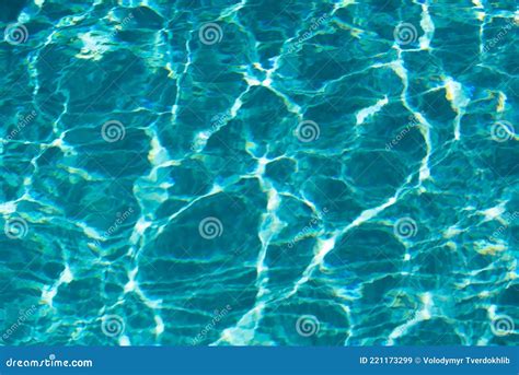 Abstract Ripple Wave And Clear Turquoise Water Surface In Swimming Pool