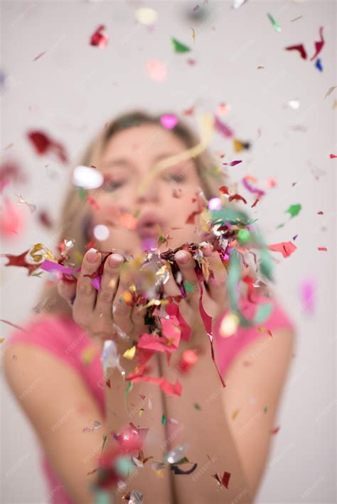 Premium Photo Beautiful Woman Blowing Confetti In The Air Party New