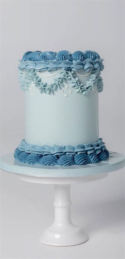 A White Cake With Blue Frosting On Top