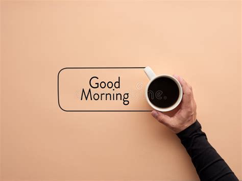 A Hand Is Holding A Cup Of Coffee With The Word Good Morning Breakfast