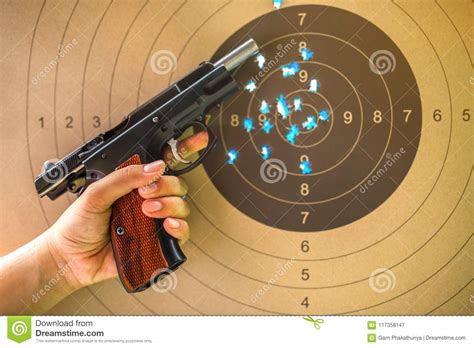 9 Mm Hand Gun on Bullseye Target for Shooting Practice. Stock Image ...