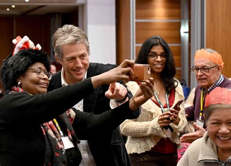 Hugh Grant Serves Christmas Meal to 500 Elderly London Residents: Photos