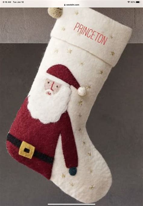 A Christmas Stocking Hanging From The Ceiling With A Santa Clause On It