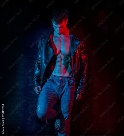 Muscular Bodybuilder Opening Leather Jacket On Naked Muscle Torso Stock Photo Adobe Stock