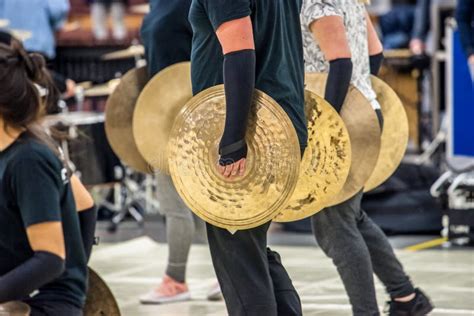 Multiple Copper Colored Marching Band Cymbals in a Row Stock Photo - Image of hand, music: 114085310