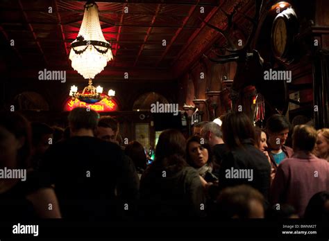 The crowded interior of the Stag's Head Pub, Dublin, with its namesake ...