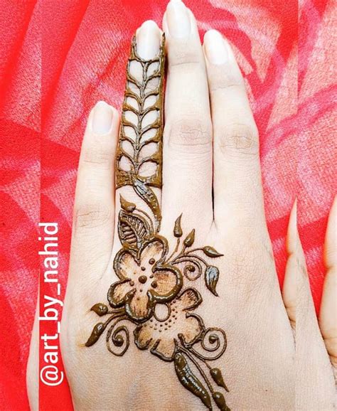 A Henna Design On The Palm Of A Woman S Hand With Red Background