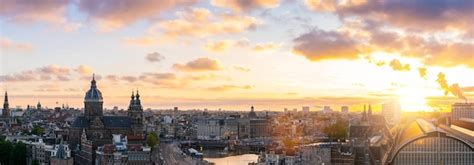 Premium Photo Amsterdam Skyline Panorama Historical Area At Sunst