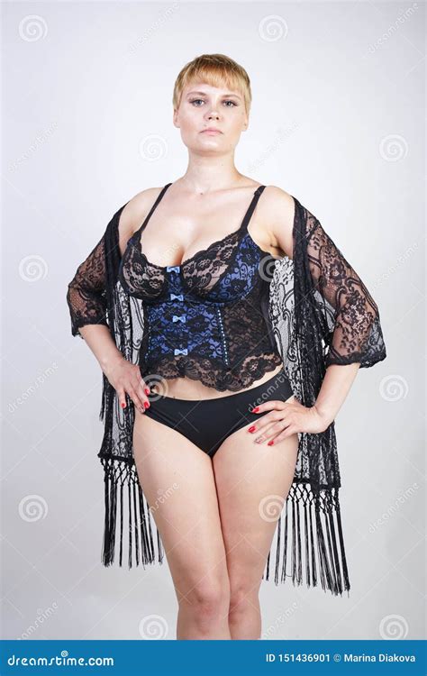 Plus Size Woman With Short Hair In Blue And Black Lace Corset Lingerie