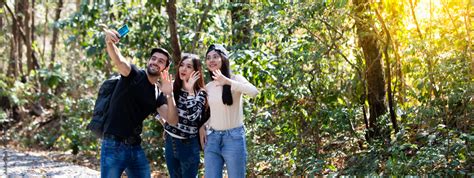 Friends Camping summer concept. Group Of Friends Relaxing and selfie hiking in rain forest Stock ...