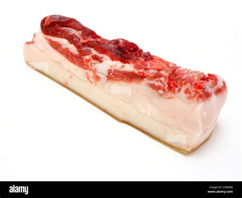 The big piece of fresh fat with a meat layer on a white background ...