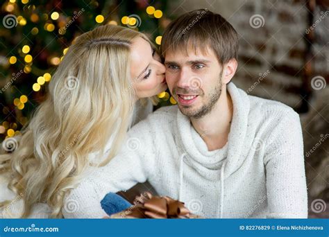 Happy Couple Of Lovers In White Pullovers Give Each Other Ts Stock