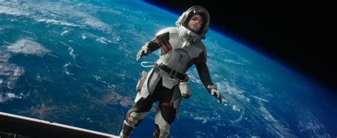 An Astronaut Floating In Space Next To The Earth S Horizon With His