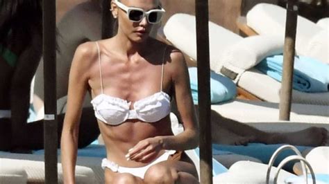 Alina Baikova Displays Her Slender Bikini Body On The Beach Photos