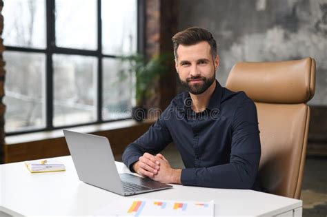 Portrait of Young Man Sitting at His Desk in the Office Stock Image ...