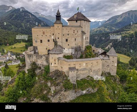 Drone view at Tarasp castle on the Swiss alps Stock Photo - Alamy