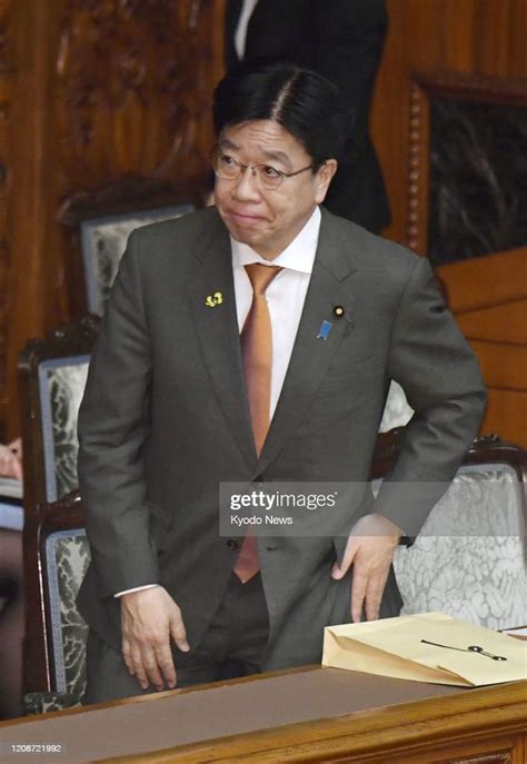 Katsunobu Kato, Japan's minister of health, labor and welfare, bows ...