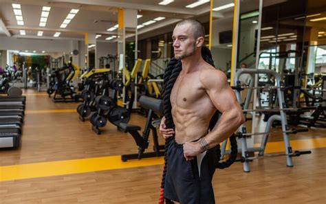 Premium Photo Portrait Of Muscular Trainer Man With Naked Torso In The Gym