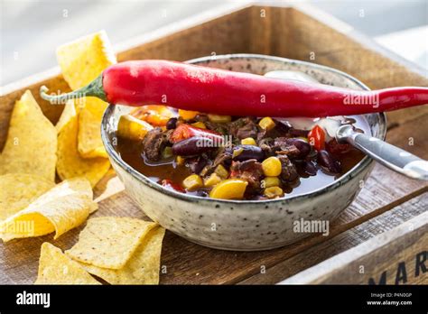 Chilli Con Carne With Tortilla Chips Stock Photo Alamy