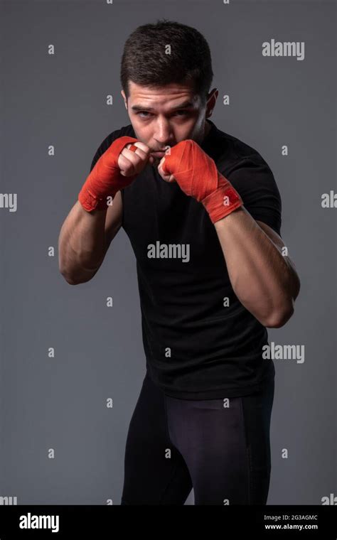 Man with wrist wraps on hands standing in orthodox boxing stance Stock ...