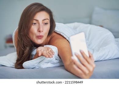 Brunette Sexy Girl On Bed Phone Stock Photo 2211598449 Shutterstock