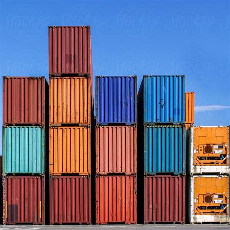 Stacked Cargo Containers In Storage Area Of Freight Sea Port Terminal