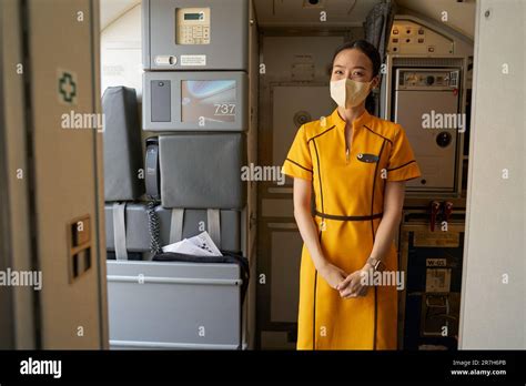 CHIANG MAI, THAILAND - CIRCA APRIL, 2023: Nok Air flight attendant in uniform on board Boeing ...