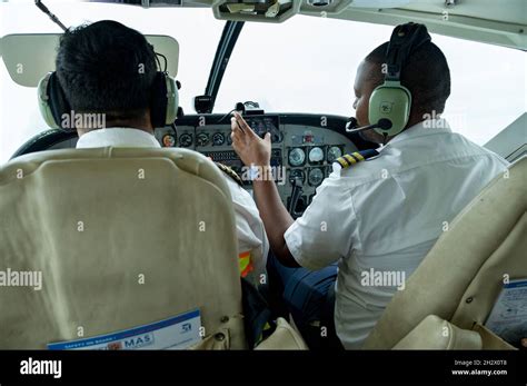 Captain and co-pilot in cockpit during flight, Nairobi, Kenya Stock Photo - Alamy