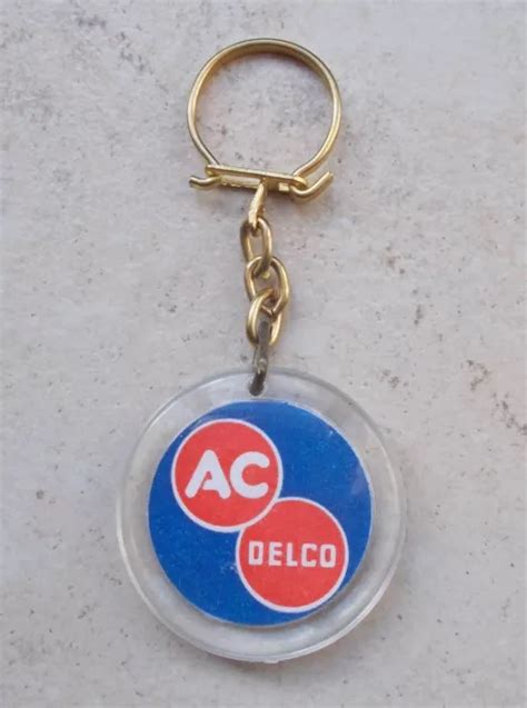 ANCIEN PORTE CLEFS clés vintage GM General Motors AC automobilia 1960s