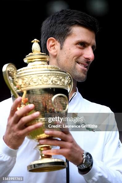 Novak Djokovic Of Serbia Poses For A Photo With The Trophy After