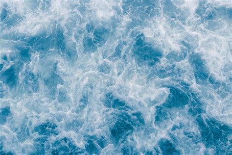 Pale Blue Sea Surface With Waves At High Tide And Surf Abstract