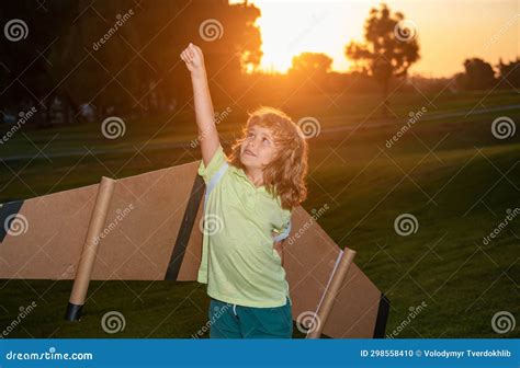 Kid Superhero With Jetpack Child Pilot Play On Summer Day At Sunset