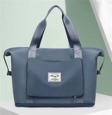 High capacity folding travel bag. Blue