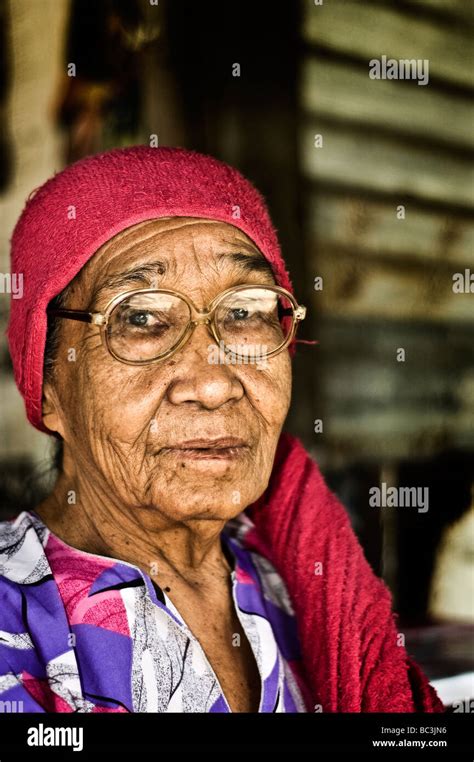 Portrait Of Old Traditional Malay Woman At A Kampung Pasir Puteh