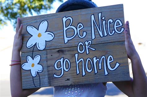 be nice or go home welcome sign reclaimed by SlightImperfections