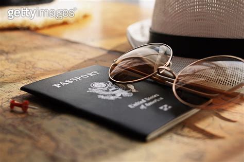 Passport Placed On The World Map Travel Concept