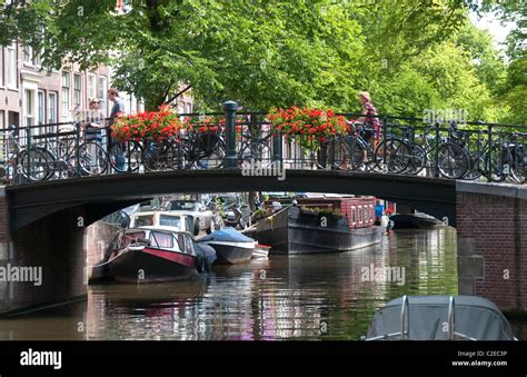 Typical canal bridge in Amsterdam Stock Photo - Alamy