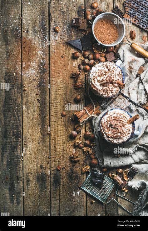 Hot Chocolate With Whipped Cream Nuts Spices And Cocoa Powder Stock Photo Alamy