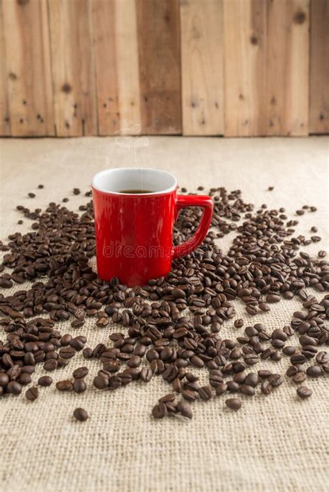 Smoking Espresso In Red Cup With Coffee Beans And Old Coffee Mil Stock