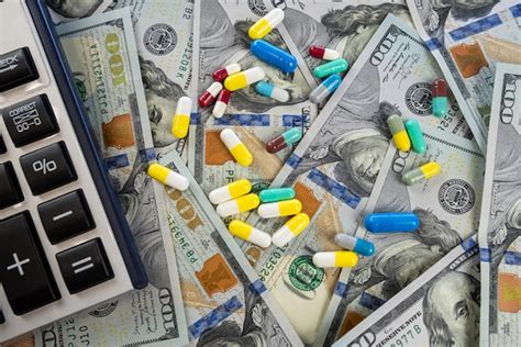 Premium Photo Calculator And Medical Pills Lying On Us Dollar Banknotes