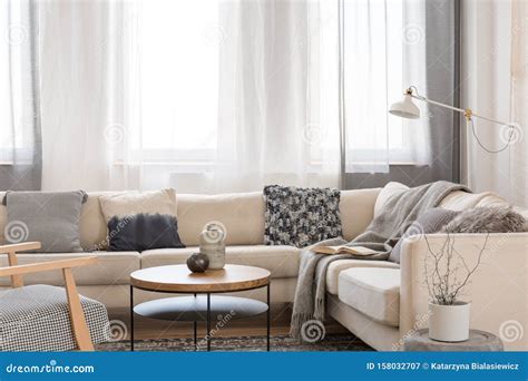 Beige Comfortable Corner Sofa with Grey Pillows in Elegant Living Room ...