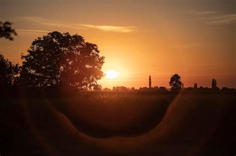 Premium Photo | Orange sunset landscape country field