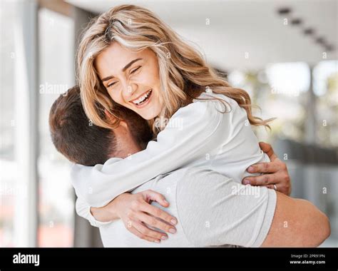 Beautiful Woman Hugging Husband While Smiling In Their Home Young Wife