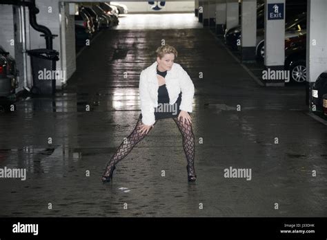 Beautiful Blonde Gir Wearing A Black Outfit In A Car Park Locationl Stock Photo Alamy
