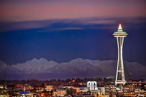 Space Needle And Cascades Mountains East Of Seattle By Conor Musgrave