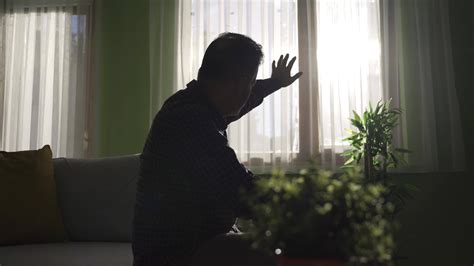 Worried Pensive Old Man Sitting Alone At Home Thinking About Life