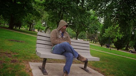 A Sad Man Sits Alone On A Park Bench. Stock Footage Video 3959047 - Shutterstock