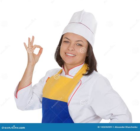 Cocinero Hermoso Showing Okay Sign De La Mujer Joven Imagen De Archivo