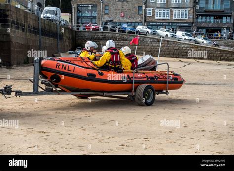 Rnli Lifeboat Drill With Lifeboat Crew Sitting In Rib On Trailer St