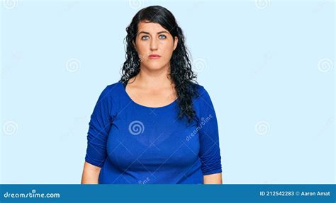 Plus Size Brunette Woman Wearing Casual Clothes With Serious Expression On Face Stock Image